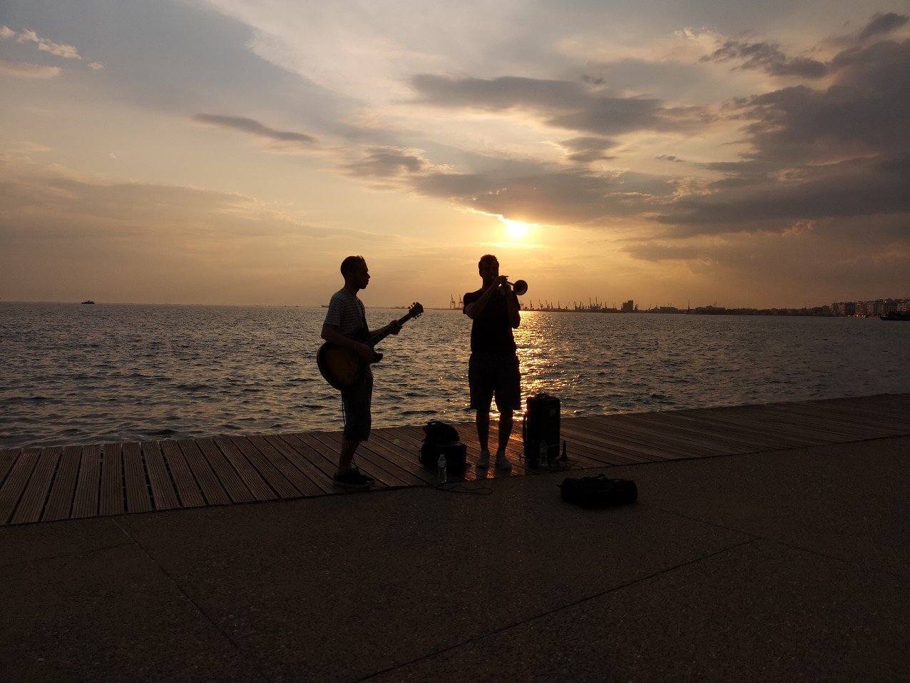 Musicians against setting sun 